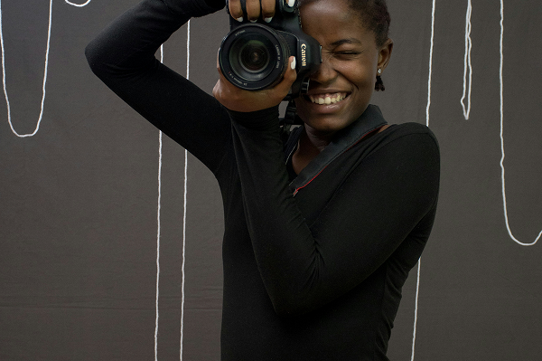 Student holding camera